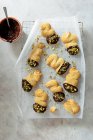 Butter biscuits dipped in dark chocolate and sprinkled with pistachios — Stock Photo
