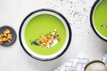 Pea soup with nut topping, sesame and yoghurt — Stock Photo