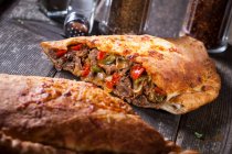 Calzone with meat and peppers — Stock Photo