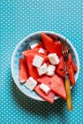 Serving of Watermelon and Feta Cheese Salad in bowl with knife — Stock Photo