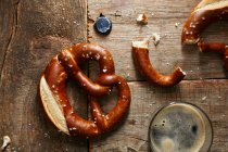 Bavarian pretzels with glass of dark beer — Stock Photo