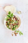 Bulgur salad with pecan nuts, pomegranate seeds and figs — Stock Photo