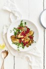Grilled eggplant, watercress and pomegranate salad — Stock Photo