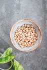 Chickpeas in a handmade clay bowl — Stock Photo