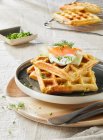 Potato waffles with salmon, sour cream, cucumber, dill and chives - foto de stock