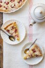 A piece of cake and a pear tart. selective focus — Stock Photo