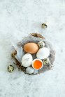 Mixed chicken and quail eggs — Stock Photo
