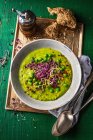Pureed pea soup with sprouts — Stock Photo