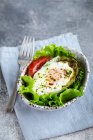 Baked eggs in avocado breakfast — Stock Photo