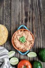 Refried beans with fried corn tortillas, avocados, tomatoes and fresh limes — Stock Photo