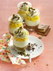 Small cheesecakes in a glass with mango cubes and cream — Stock Photo