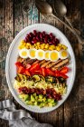 Cobb salad with vegetables, cheese, beef, corn and egg (USA) — Stock Photo