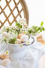 Eggs and cherry blossoms branches as spring decorations — Stock Photo