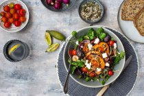 Watercress salad with beetroot, sweet potatoes, tomatoes and feta — Stock Photo