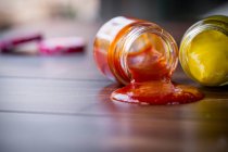 Dropped jars with sauce — Stock Photo