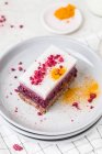 A slice of raspberry panna cotta cake with turmeric — Stock Photo