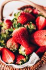 Fresh strawberries in a wicker basket — Stock Photo