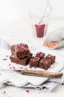 Brownie bites with chocolate and dried raspberries — Stock Photo