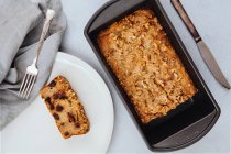 Freshly baked chocolate chip banana bread loaf topped with walnuts — Stock Photo
