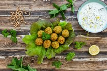 Close-up shot of delicious Falafel on salad with tzatziki — Stock Photo