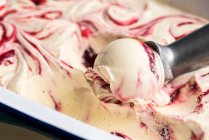 Ice cream with raspberries jam and metal scoop — Stock Photo