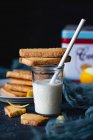 Polenta cookies on glass of milk — Stock Photo