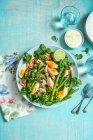 Poached salmon and watercress salad with asparagus and eggs — Stock Photo