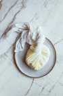 Close-up shot of delicious Labneh in closed cheese cloth — Stock Photo