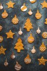 Firs, baubles and stars. christmas gingerbread biscuits — Stock Photo