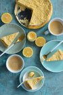 Lemon curd cheesecake slices on the plates — Fotografia de Stock