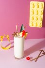 Pina colada cocktail with pineapple, cherries decorations and decorating tools — Stock Photo