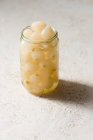 Pickled small onions in a jar — Stock Photo