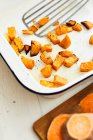 Roasted sweet potato pieces — Stock Photo