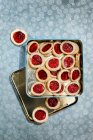 Shortbread jam-filled biscuits in metal tin — Stock Photo