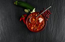 Chunky Vegetable Bean Soup mit cream and paprika — Stock Photo