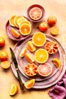 Citrus fruits and spices on a wooden background. top view. — Stock Photo
