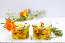 Pickled manchego with herbs, lemon, jalapenos and garlic — Stock Photo