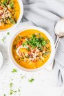 Peanut and sweet potato soup with topping — Stock Photo