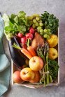 Seasonal organic fruit and vegetable basket — Stock Photo
