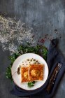 Puff pastry with trout lemon sauce and capers — Stock Photo
