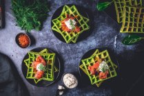 Spinach waffles with smoked salmon and horseradish cream — Stock Photo