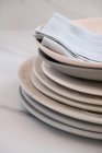 Plates with cloth Stacked On Marble surface — Stock Photo
