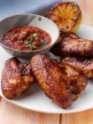 BBQ Chicken wings with tomato salsa — Stock Photo