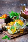 Detox water with citrus fruits, ginger and honey — Stock Photo