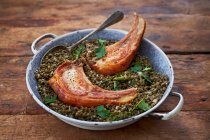 Pork chops with puy lentils — Stock Photo