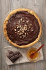 Chocolate tart with hazelnuts and honey — Stock Photo