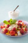 Fresh fruit salad with oats, quark and mint — Stock Photo