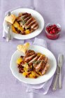 Duck breast with oranges, dried cranberries andcranberry onion chutney — Stock Photo