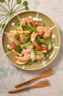 Prawn salad with cucumber, apple, mint and red peppercorns — Stock Photo