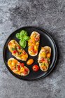 Bruschetta with colourful tomatoes and basil — Stock Photo